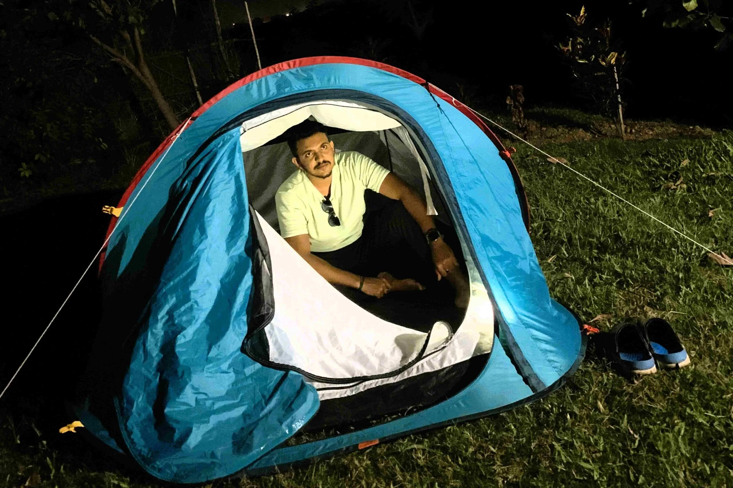 A tent pitched beside the cottages