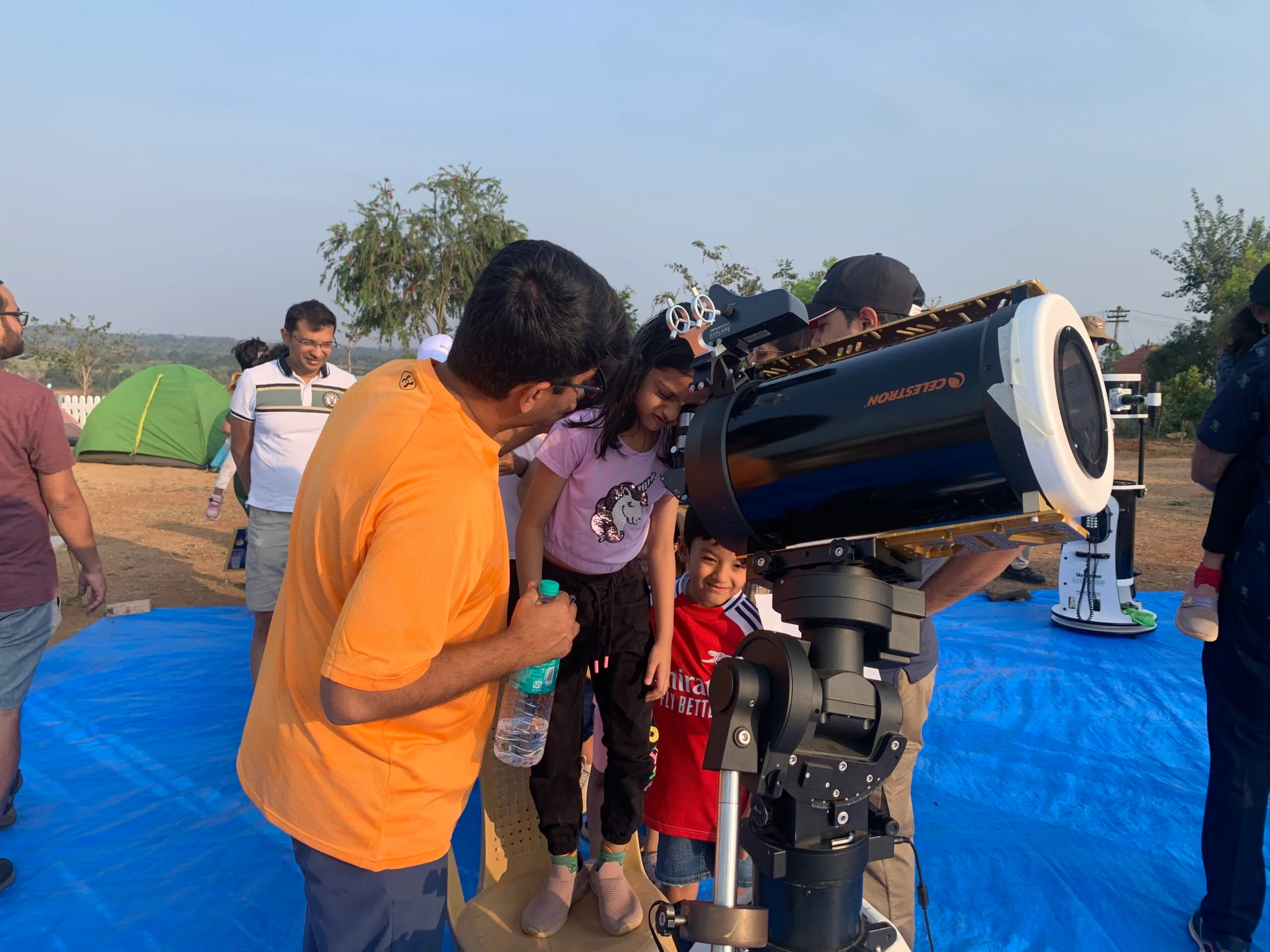 Guests taking turns at the telescope during dark-sky stargazing