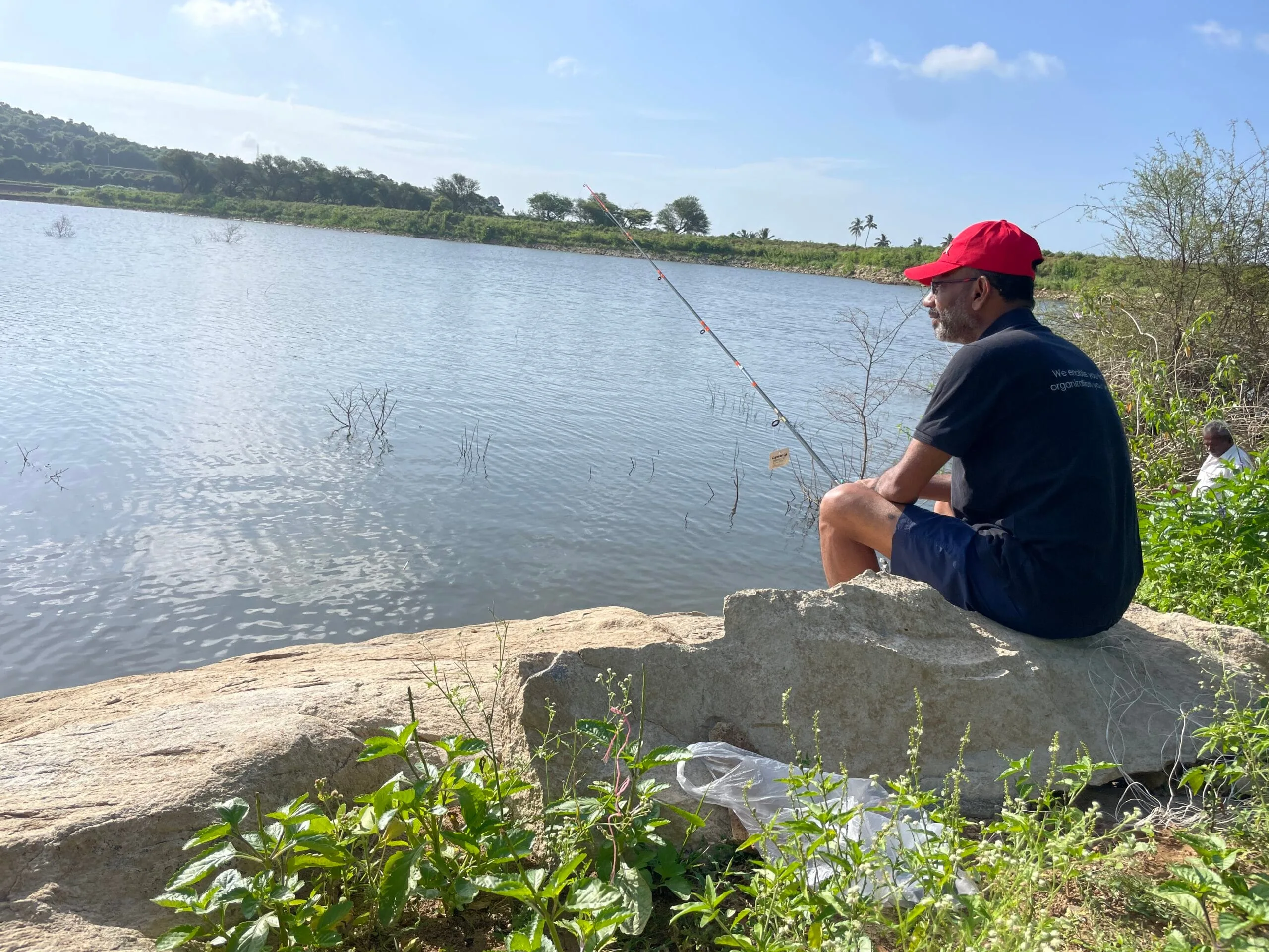 Fishing from the bank of Athetti Lake near Shoolagiri